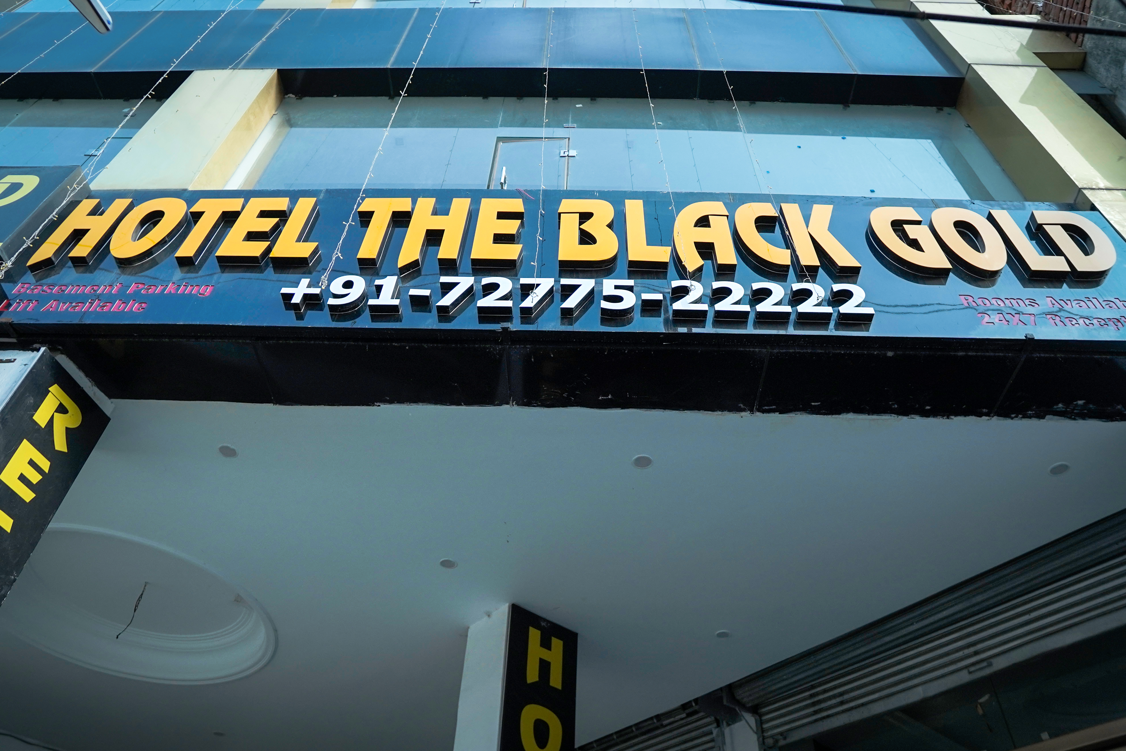 View of the refined black and gold interior of Hotel The Black Gold in Chandigarh